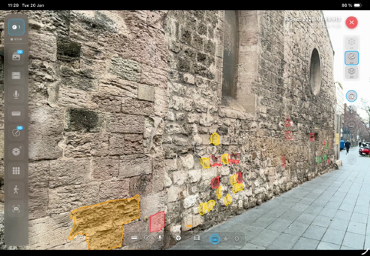 Augmented-reality view of a stone wall with reprojected spatial annotations